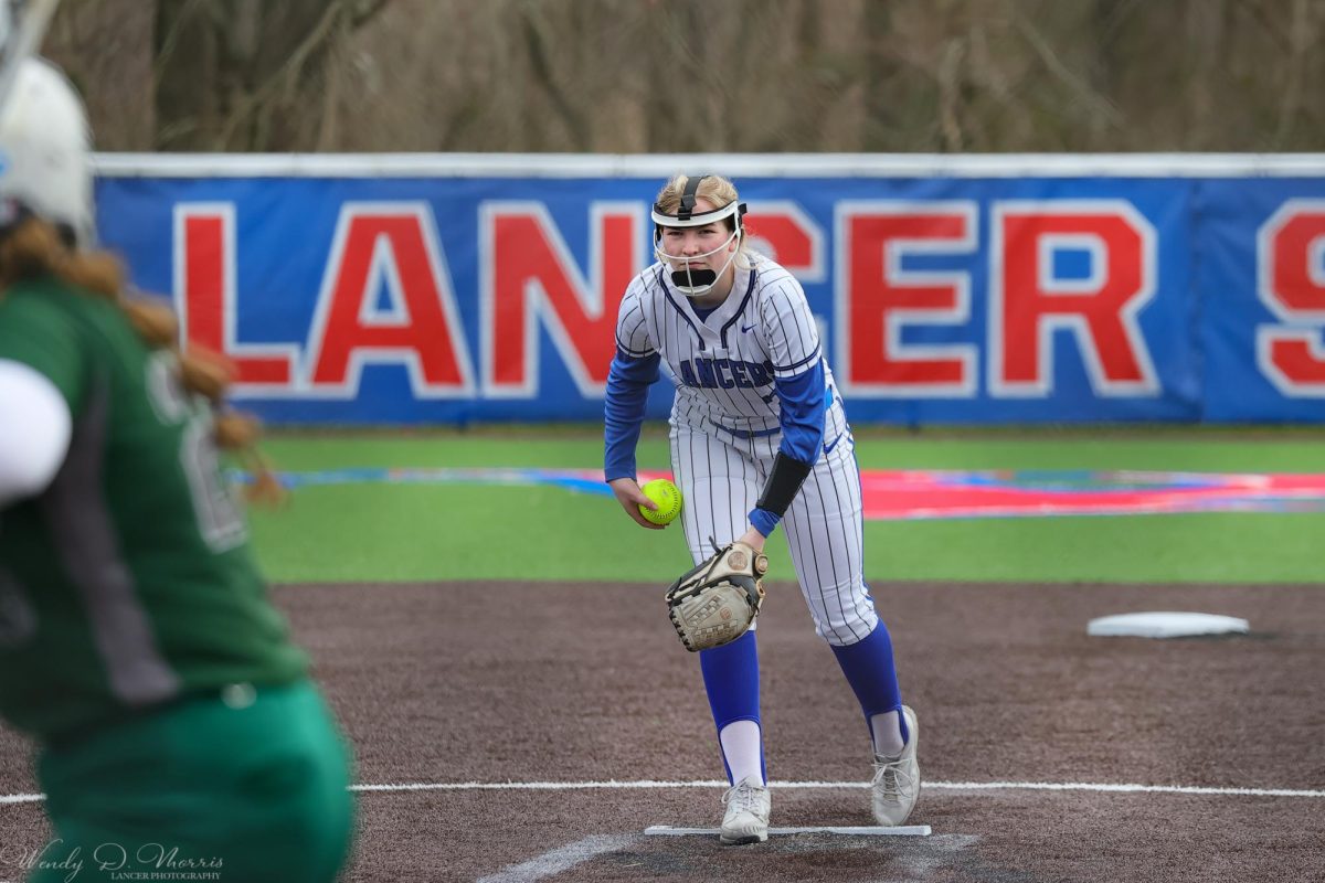 Brielle Kenney about to throw a pitch in Waterford's game against Chariho on April 11, 2024