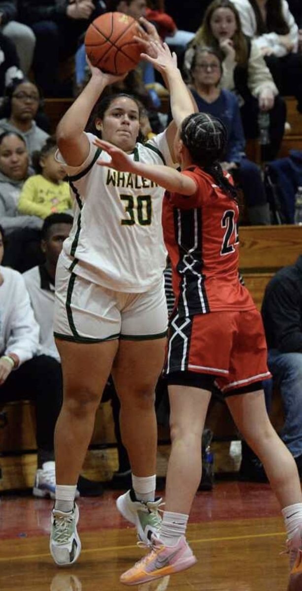 Marlena playing for New London Multi Magnet School basketball team 